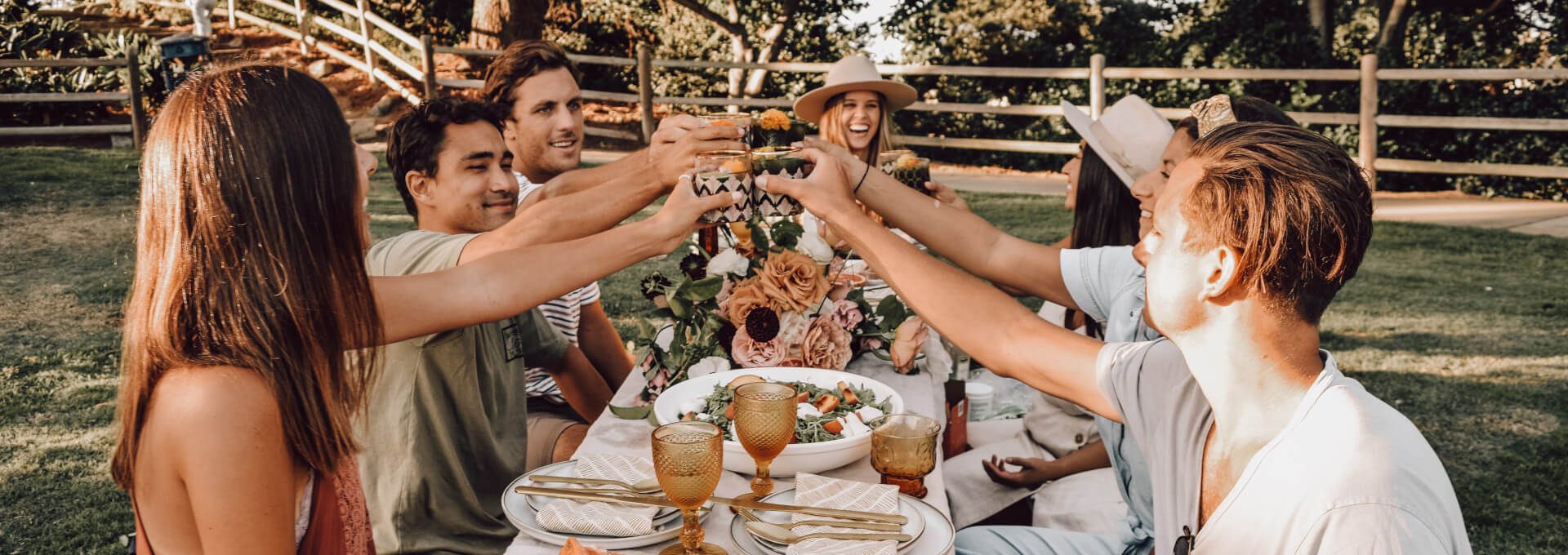 friends clinking wine glasses